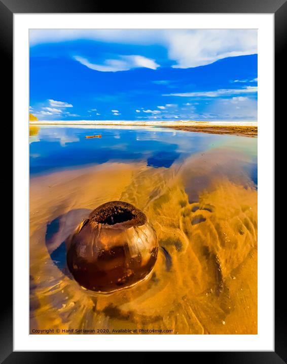 Coconut on sand beach 1 Framed Mounted Print by Hanif Setiawan