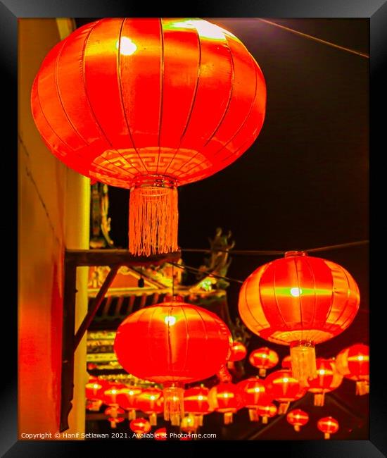 Red lantern as street lights hanging at a wall for Chinese New Year Framed Print by Hanif Setiawan