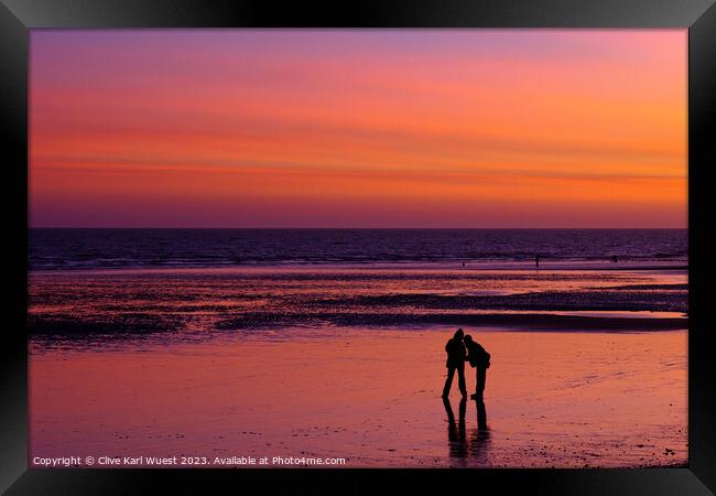 Sunset on Hastings Beach Framed Print by Clive Karl Wuest
