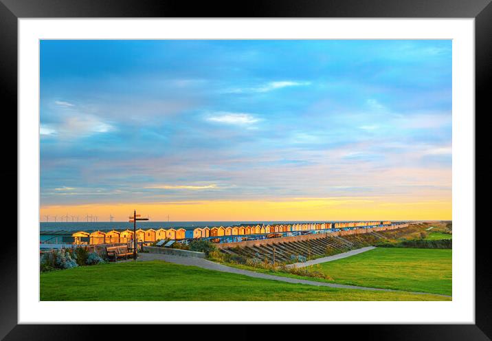 Sunset over the beach huts at Frinton-on-Sea Framed Mounted Print by Paula Tracy