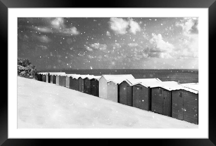 Pretty Beach huts in the snow at Frinton  Framed Mounted Print by Paula Tracy