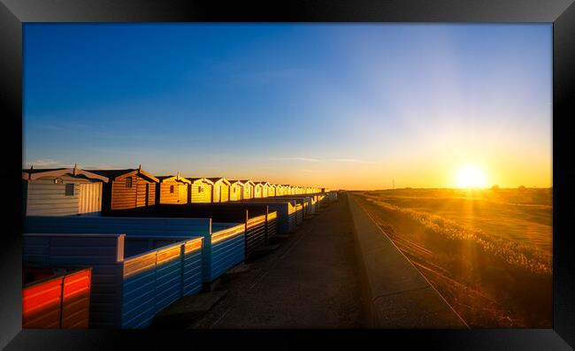 Sunset over the Walings beach huts Frinton-on-Sea Framed Print by Paula Tracy