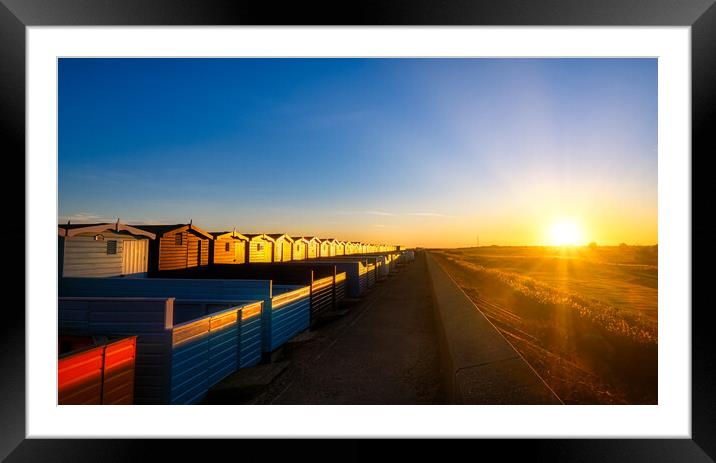 Sunset over the Walings beach huts Frinton-on-Sea Framed Mounted Print by Paula Tracy
