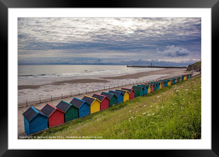 Whitby Beach huts waiting for the storm Framed Mounted Print by Richard Perks