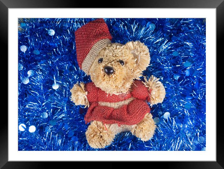 Teddy bear on blue tinsel Framed Mounted Print by aurélie le moigne
