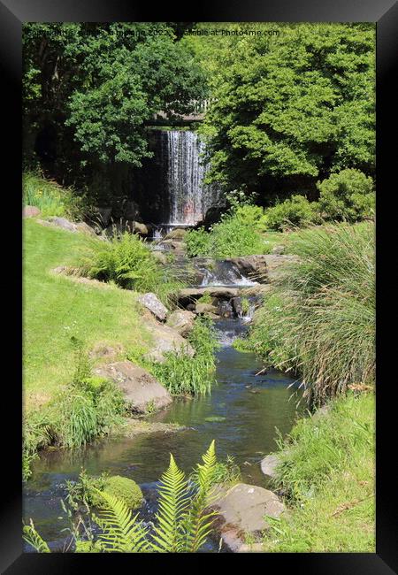 River and waterfall in a park Framed Print by aurélie le moigne