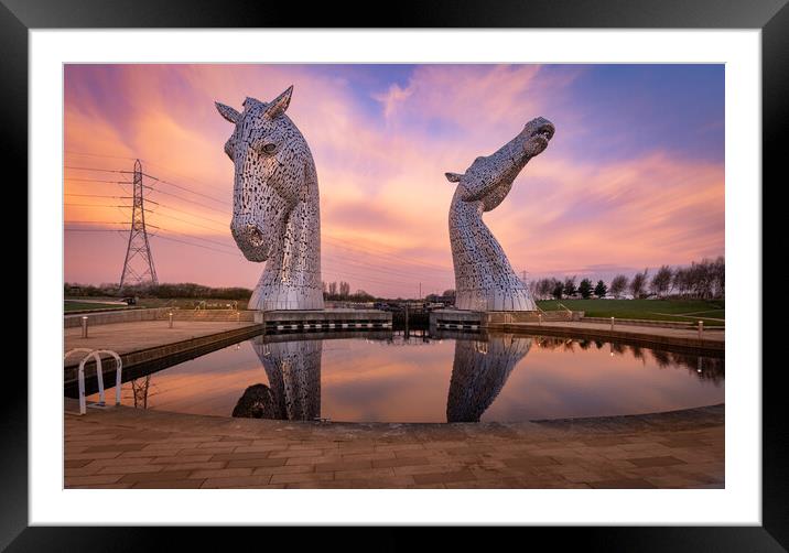 Mirror reflections of the Kelpies at sunrise Framed Mounted Print by Kevin Winter