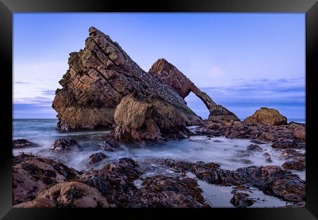 Crashing tide at Bow fiddle rock Framed Print by Kevin Winter
