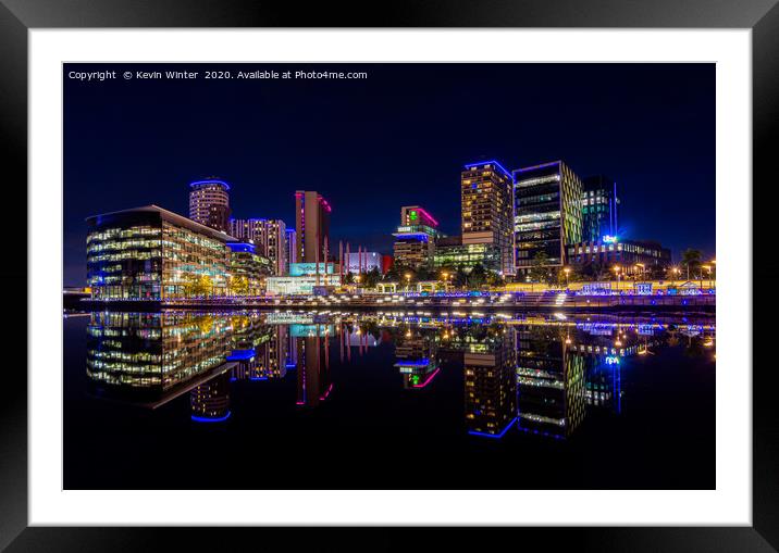 Tram arriving at the Media City in Salford Quay Framed Mounted Print by Kevin Winter