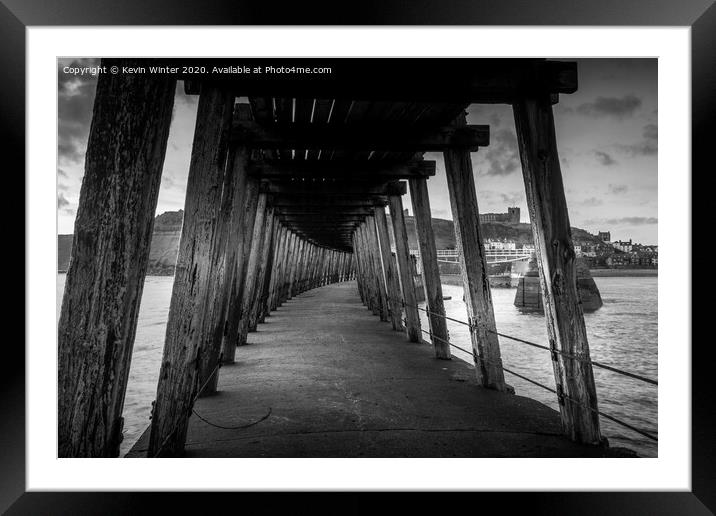 Under the East pier Framed Mounted Print by Kevin Winter