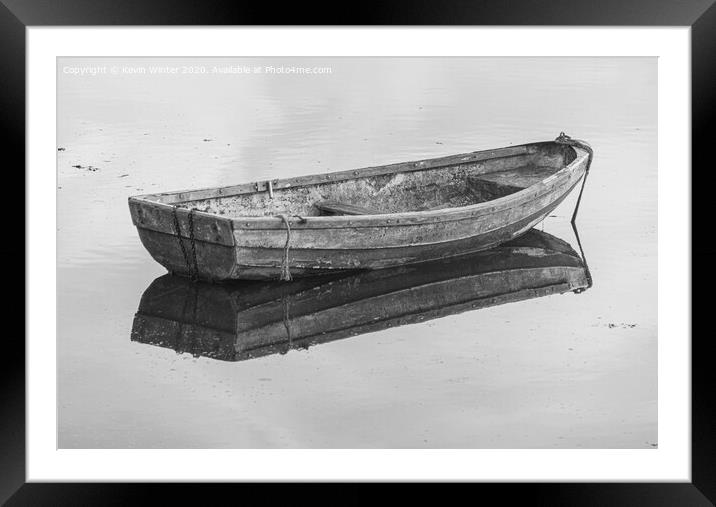 Lone boat Framed Mounted Print by Kevin Winter