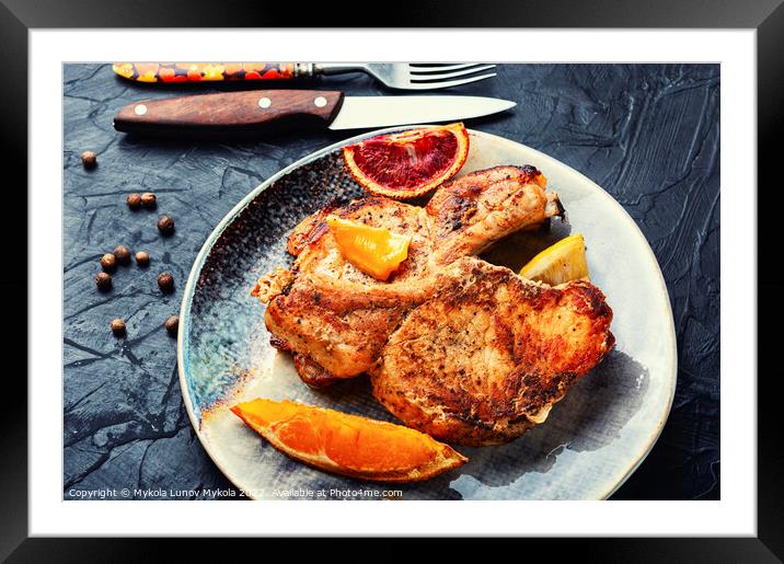 Roast pork chop meat in orange sauce Framed Mounted Print by Mykola Lunov Mykola