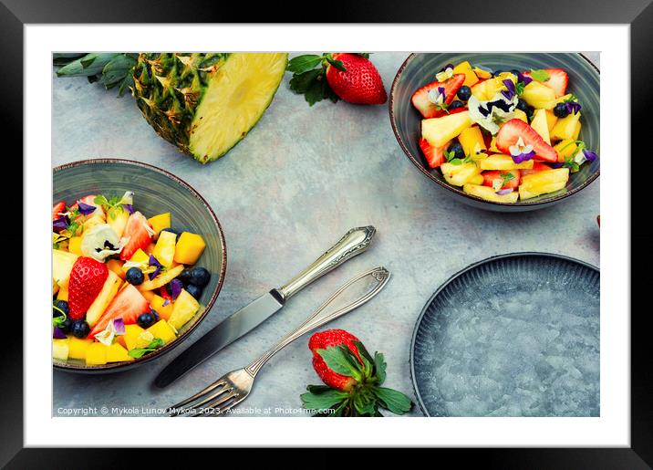 Fruit salad decorated with flowers. Framed Mounted Print by Mykola Lunov Mykola