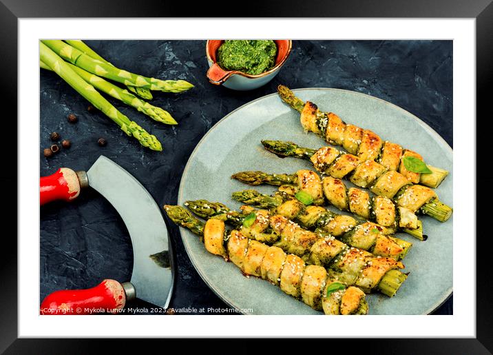 Asparagus baked in bread. Framed Mounted Print by Mykola Lunov Mykola