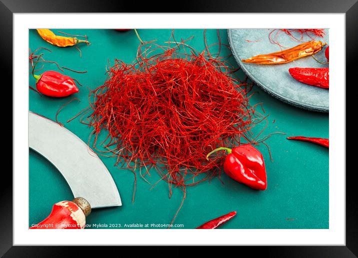 Hot red pepper spice. Framed Mounted Print by Mykola Lunov Mykola