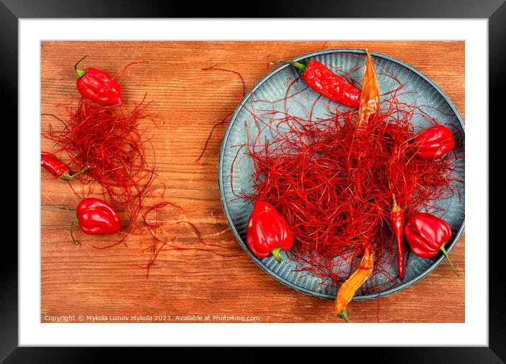 Hot pepper spice. Framed Mounted Print by Mykola Lunov Mykola