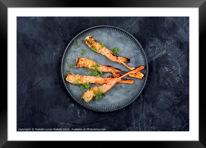 Grilled tiger shrimps, black background Framed Mounted Print by Mykola Lunov Mykola
