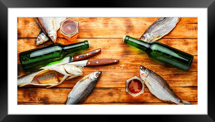 Dried fish and beer Framed Mounted Print by Mykola Lunov Mykola
