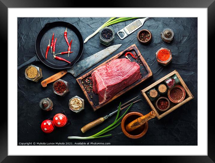 Raw veal meat with seasoning Framed Mounted Print by Mykola Lunov Mykola