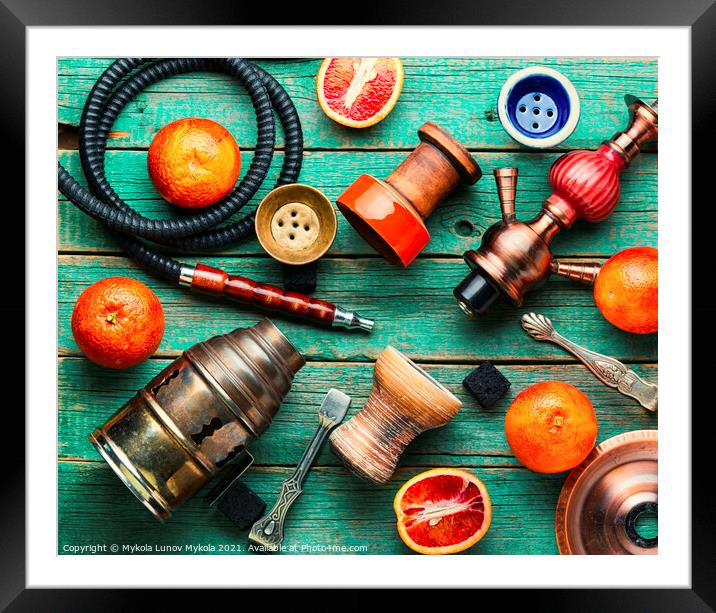 Smoking hookah with grapefruit flavor Framed Mounted Print by Mykola Lunov Mykola