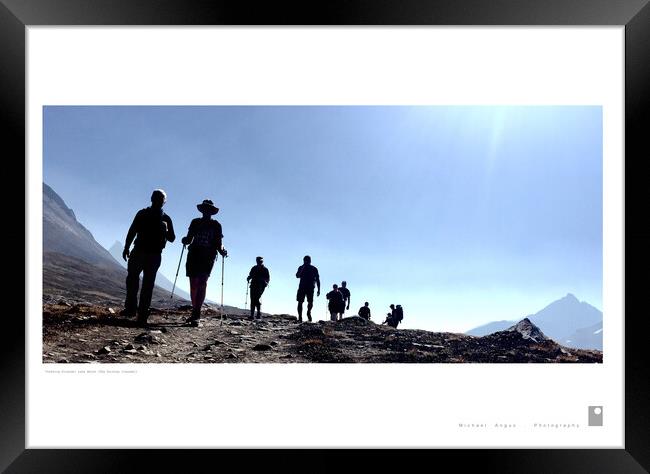 Trekking Friends: Lake Helen (Rockies) Framed Print by Michael Angus
