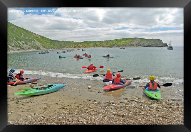 Canoes at Lulworth Cove, Dorset Framed Print by Laurence Tobin