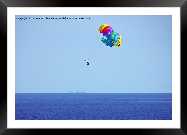 Parasailing above the sea at Biarritz, France Framed Mounted Print by Laurence Tobin