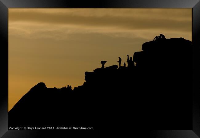 Dusky sunset peak district scene. People line the top of stanage edge Framed Print by Rhys Leonard