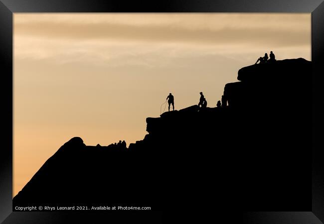 Striking sunset scene of stanage edge rock formations. People on top Framed Print by Rhys Leonard