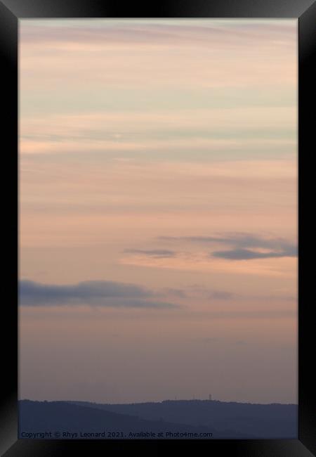 Vertical hazy sunset. Horizon under warm and faded pastel colours. Framed Print by Rhys Leonard