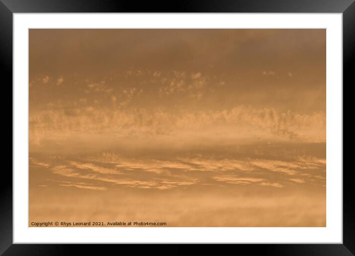 Golden sunset sky, telephoto perspective gives abstract background Framed Mounted Print by Rhys Leonard