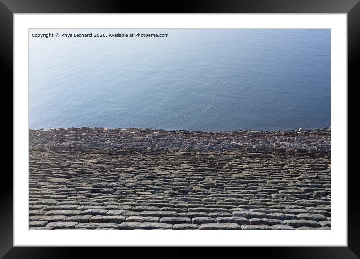 Half bright sunny blue water and half stone reservoir wall texture Framed Mounted Print by Rhys Leonard