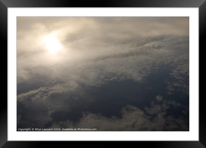 Reflection of evening sun and clouds in still redmires reservoir water. Framed Mounted Print by Rhys Leonard