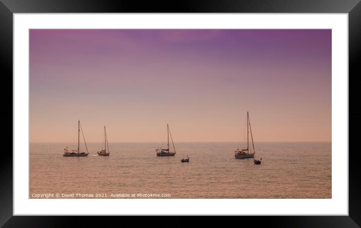 Glowing boats in tranquil Madeira Framed Mounted Print by David Thomas