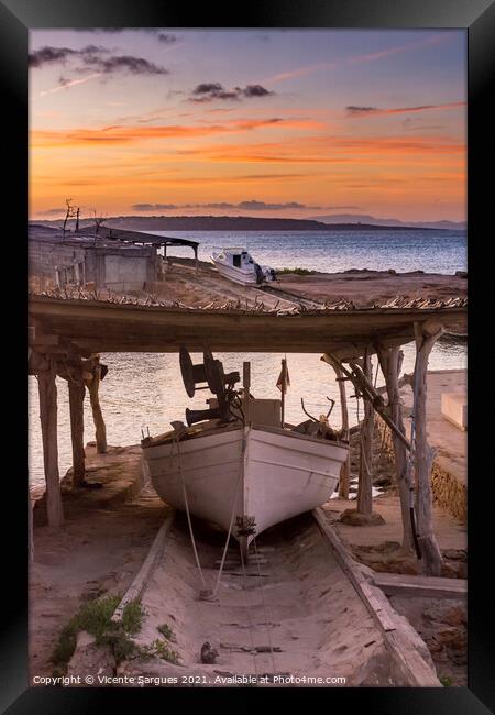 Fishing boat on its jetty at sunset Framed Print by Vicente Sargues