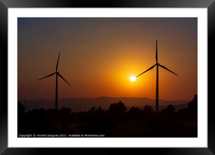 Two windmills facing the sun at sunset Framed Mounted Print by Vicente Sargues