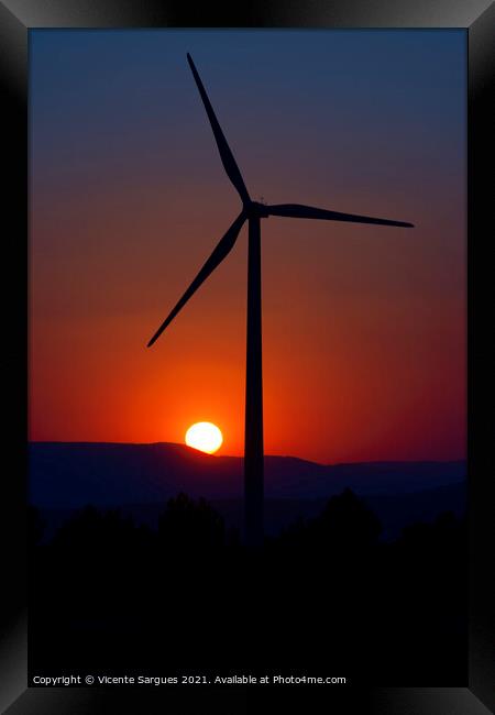 Windmill in front of the evening sun Framed Print by Vicente Sargues