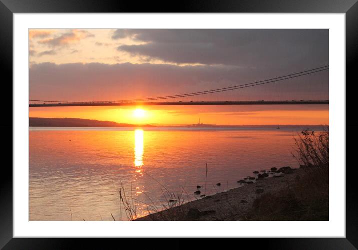 The Sun setting under the Humber Bridge Framed Mounted Print by Judith Oatley
