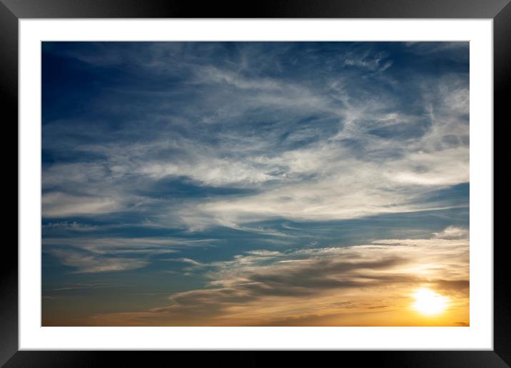 Dramatic clouds in sunset light Framed Mounted Print by Arpad Radoczy