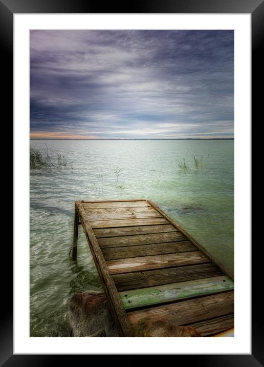 Wooden pier in lake Balaton of Hungary in a cloudy Framed Mounted Print by Arpad Radoczy
