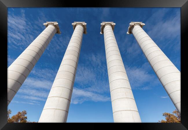 Four massive columns, blue sky in Barcelona of Spain Framed Print by Arpad Radoczy