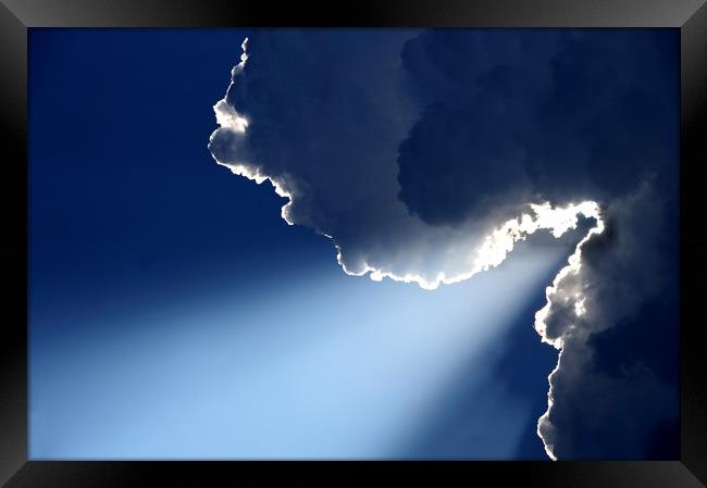 Sunrays on blue skythrough white clouds Framed Print by Alessandro Della Torre