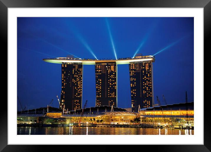 A lit up city at night with Marina Bay Sands Singapore in the background Framed Mounted Print by Alessandro Della Torre