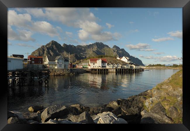 Lofoten island in front of water with a mountain in the background Framed Print by Alessandro Della Torre