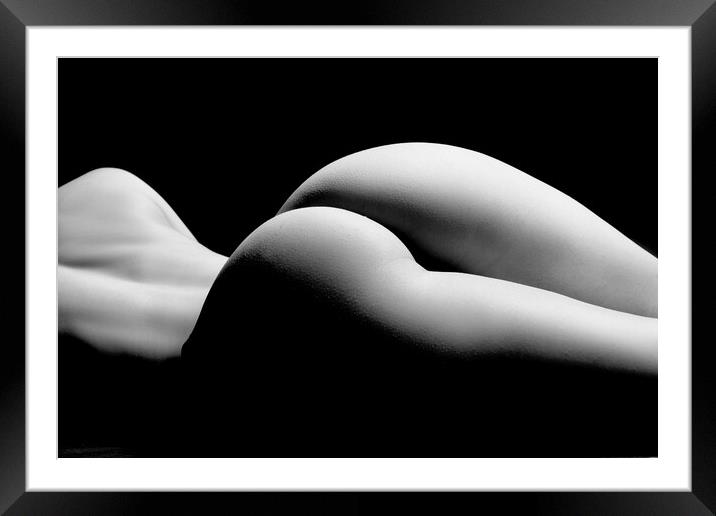 ass of a woman naked and nude fine art photography bodyscape laying on black studio background Framed Mounted Print by Alessandro Della Torre