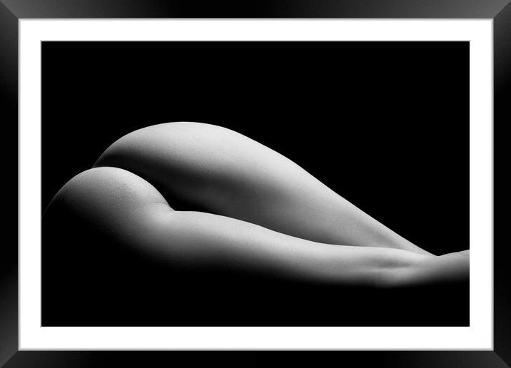 ass of a woman naked in fine art photography bodyscape laying on black studio background Framed Mounted Print by Alessandro Della Torre