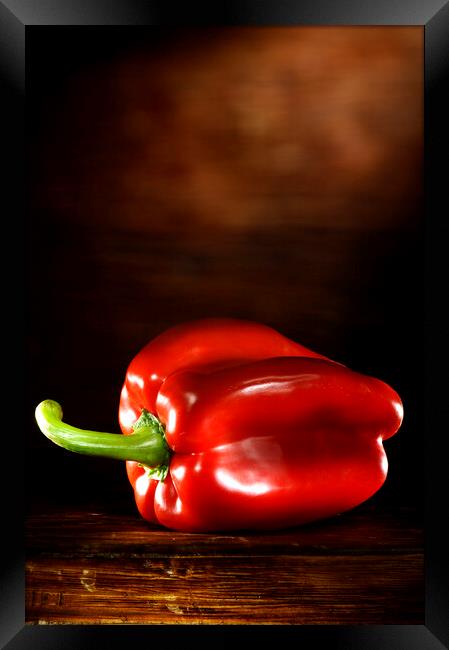 Red Pepper on a wood table Framed Print by Alessandro Della Torre