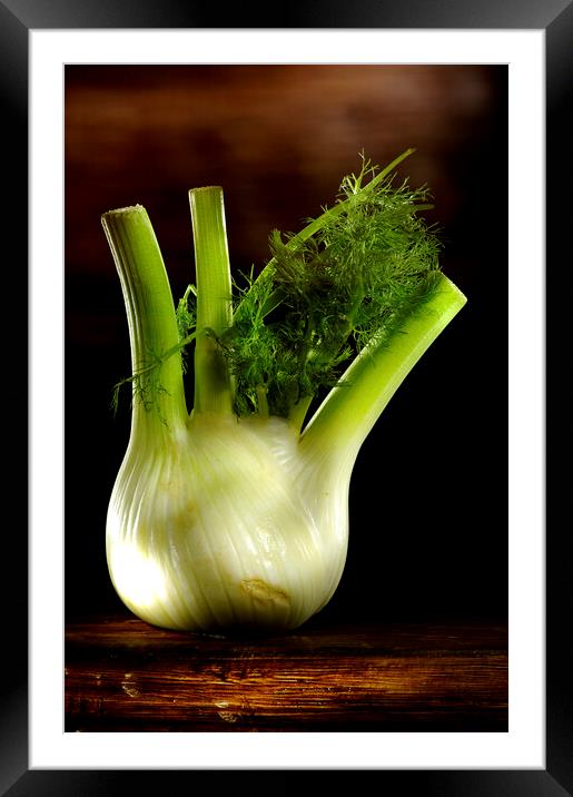 a green fennel on a wood table Framed Mounted Print by Alessandro Della Torre