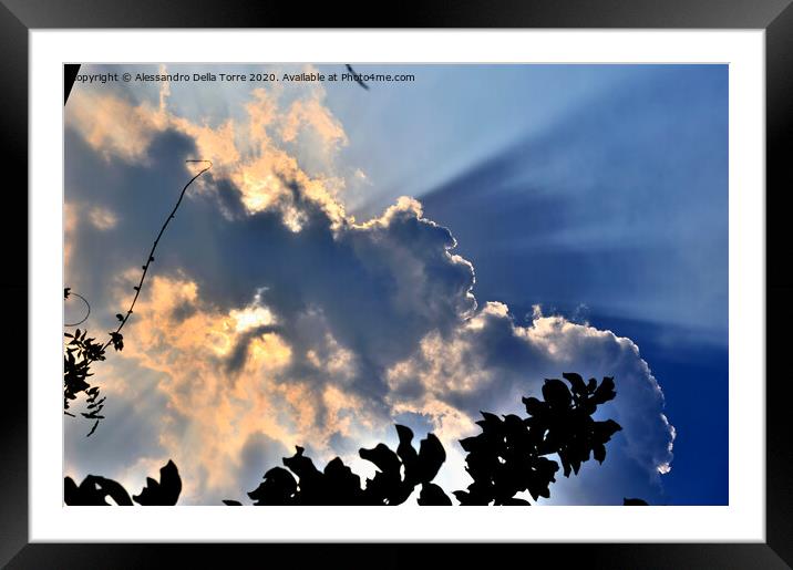 sunlight coming put from a group of clouds Framed Mounted Print by Alessandro Della Torre