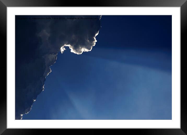 Sunlight rays coming out from clouds Framed Mounted Print by Alessandro Della Torre